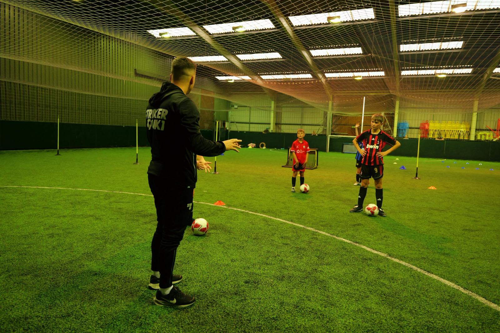 Youth football training session at StrikerUK1 indoor facility in Barnsley led by professional coach Zak Dearnley